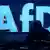  AfD logo with shadowy figure in front