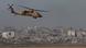 An Israeli helicopter flights near the Israel-Gaza border amid military operations against Hamas An Israeli helicopter flights near the Israel-Gaza border amid military operations against Hamas