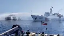 In this image taken from video provided by the Philippine Coast Guard, a Chinese Coast Guard ship, right, uses a water cannon on a Philippine Bureau of Fisheries and Aquatic Resources (BFAR) vessel as it approaches Scarborough Shoal in the disputed South China Sea on Saturday Dec. 9, 2023. The Philippines and its treaty ally, the United States, separately condemned a high-seas assault Saturday by the Chinese coast guard and suspected militia ships that repeatedly blasted water cannons to block three Philippine fisheries vessels from a disputed shoal in the South China Sea. (Philippine Coast Guard via AP)