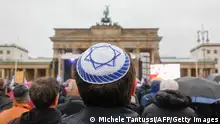 10/12/2023 *** A young man wears a kippah during a demonstration against anti-Semitism on December 10, 2023 at Brandenburger Gate in Berlin. (Photo by MICHELE TANTUSSI / AFP) (Photo by MICHELE TANTUSSI/AFP via Getty Images)