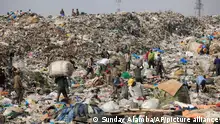 In this photo taken Friday, Jan, 24. 2014, scavengers in Lagos, Nigeria sort out iron and plastic to sell at the Olusosun dump site the city's largest dump. With a population of more than 20 million, garbage piles up on streets, outside homes and along the waterways and lagoons, creating eyesores and putrid smells. The booming city also has major electricity shortages and many residents rely on diesel generators that cloud the air with black exhaust. Nigeria's most populous city is turning these problems into an advantage by starting a program to convert waste into methane gas to generate electricity. A pilot program at a local market has already shown success on a smaller scale. Lagosâ waste management program is also organizing recycling to clean up the country's biggest city. (AP Photo/ Sunday Alamba)