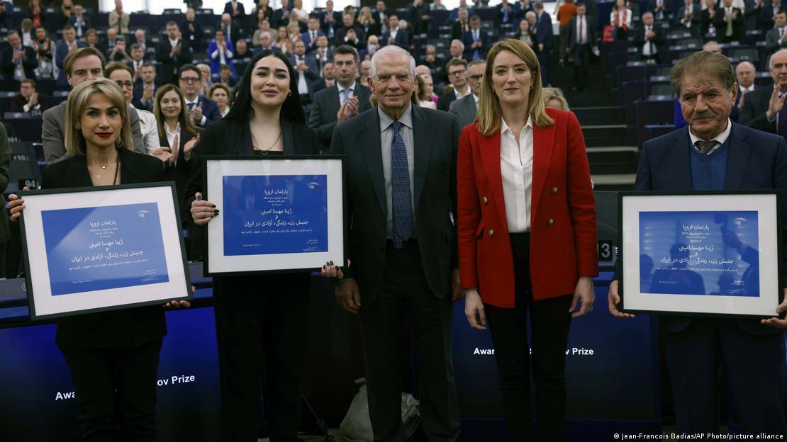 Iranian women's rights defenders Afsoon Najafi, second left, Mersedeh Shahinkar, left, Saleh Nikbakht, academic, lawyer representing Jina Mahsa Amini's family, right, President of the European Parliament Roberta Metsola, second right, and European Union foreign policy chief Josep Borrell pose during the 2023 Sakharov Prize for Freedom of Thought Award