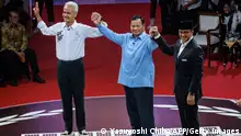 12.12.2023
Three presidential candidates, Anies Baswedan (R), Prabowo Subianto (C) and Ganjar Pranowo pose after the first presidential election debate at the General Elections Commission (KPU) office in Jakarta on December 12, 2023. (Photo by Yasuyoshi CHIBA / AFP) (Photo by YASUYOSHI CHIBA/AFP via Getty Images)