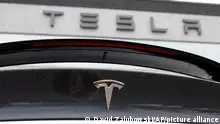 FILE - The Tesla company logo shines off the rear deck of an unsold 2020 Model X at a Tesla dealership, April 26, 2020, in Littleton, Colo. On Tuesday, Dec. 12, 2023, Virginia authorities determined that a Tesla was operating on its Autopilot system and was speeding in the moments leading to a crash with a crossing tractor-trailer last July that killed the Tesla driver. (AP Photo/David Zalubowski, File)