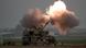 An Israeli mobile artillery unit firing a shell towards the Gaza Strip An Israeli mobile artillery unit firing a shell towards the Gaza Strip