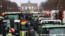 Tractors are parked near the Brandenburg Gate, as German farmers take part in a protest against the cut of vehicle tax subsidies, in Berlin, Germany, December 18, 2023. REUTERS/Christian Mang