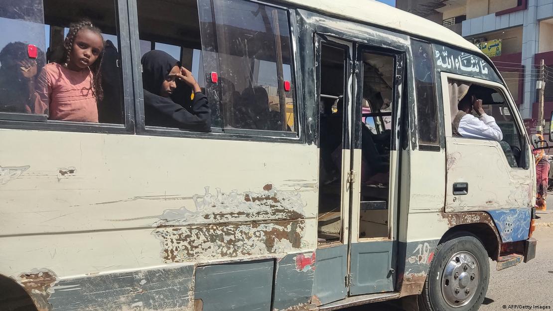 Displaced people fleeing from Wad Madani in Sudan's Jazira state arrive in Gedaref in the country's east on December 17, 2023. Paramilitary forces established a base on December 17 in the formerly safe city of Wad Madani in war-torn Sudan.