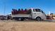 Displaced people fleeing from Wad Madani in Sudan's Jazira state arrive in Gedaref in the country's east on December 18, 2023. Paramilitary forces established a base on December 17, 2023 in the formerly safe city of Wad Madani in war-torn Sudan.