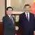 2023年12月18日，在新华社发布的这张照片中，中国国家主席习近平（右）与来访的香港行政长官李家超握手。