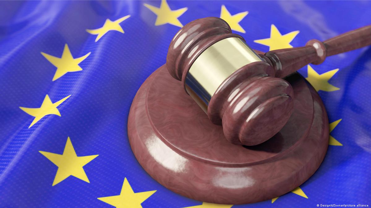An EU flag - blue with yellow stars and a gavel