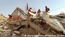 In this photo released by Xinhua News Agency, rescuers search for survivors at a collapsed houses following a massive earthquake in Dahejia Township of Jishishan Bao'an, Dongxiang, Salar Autonomous County in Linxia Hui Autonomous Prefecture, northwest China's Gansu Province, Tuesday, Dec. 19, 2023. A strong overnight earthquake rattled a mountainous region of northwestern China, authorities said Tuesday, destroying homes, leaving residents out in a below-freezing winter night and killing more than hundred people in the nation's deadliest quake in nine years. (Zhang Ling/Xinhua via AP)