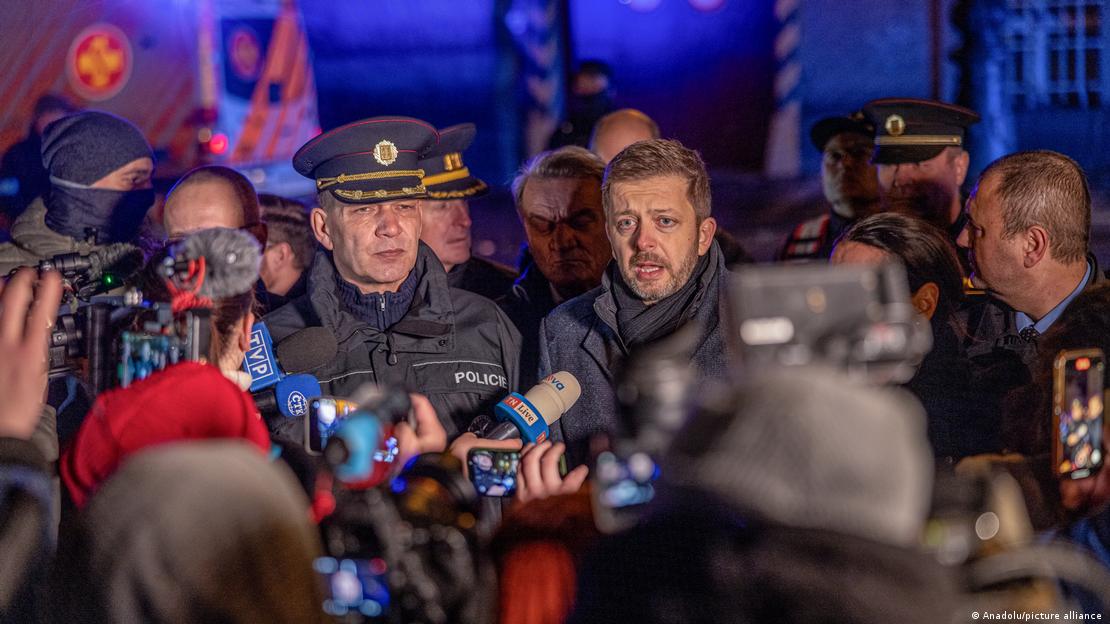 Prague Police President Martin Vondrasek (left) and Interior Minister Vit Rakusan (right) are surrounded by journalists as they speak to the press near the site of the shooting at Charles University, Prague, Czech Republic, December 21, 2023