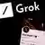 Grok logo displayed on a laptop screen and Elon Musk account on X