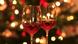 Rose wine in shiny wineglass in front of Christmas tree Rose wine in shiny wineglass in front of Christmas tree