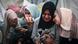 Palestinians mourn their relatives, killed in an overnight Israeli strike on the Al-Maghazi refugee camp, in the southern Gaza Strip, on December 25, 2023 Palestinians mourn their relatives, killed in an overnight Israeli strike on the Al-Maghazi refugee camp, in the southern Gaza Strip, on December 25, 2023