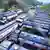 Trucks wait outside the Guwahati Refinery operated by Indian Oil Corporation,