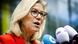 Sigrid Kaag speaks to the press to announce leaving politics, dressed in red and wearing glasses, with blonde hair Sigrid Kaag speaks to the press to announce leaving politics, dressed in red and wearing glasses, with blonde hair
