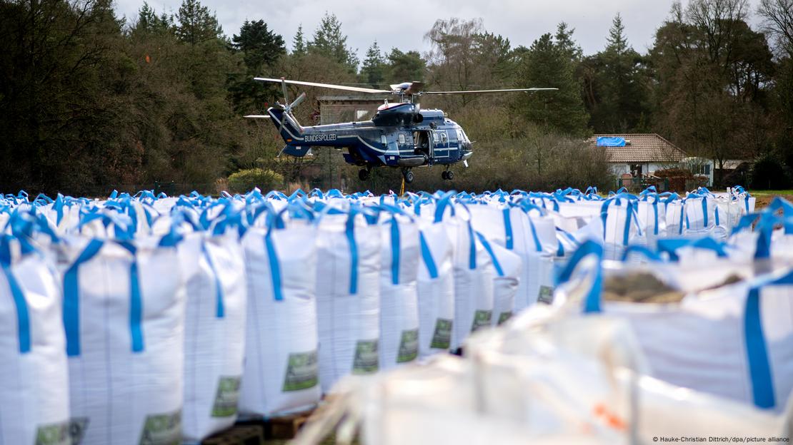 German federal police helicopter near sandbags used for the strengthening of dikes