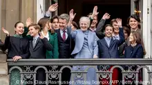 TOPSHOT - Queen Margrethe II of Denmark (C) and family members, Crown Prince Frederik of Denmark (5L), Princess Isabella of Denmark (3L), Princess Josephine of Denmark (L), Prince Vincent of Denmark, Prince Christian of Denmark, Count Henrik, Count Felix, Count Nikolai and Countess Athena wave to the crowd on the Queen's 83rd birthday from the balconies of Amalienborg Castle in Copenhagen on April 16, 2023. Queen Margrethe II is to date Europe's longest serving monarch. (Photo by Mads Claus Rasmussen / Ritzau Scanpix / AFP) / Denmark OUT (Photo by MADS CLAUS RASMUSSEN/Ritzau Scanpix/AFP via Getty Images)
