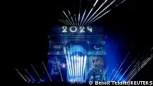 2024 is projected onto the Arc de Triomphe to celebrate the entry into the Olympic year, during the New Year's celebrations on the Champs Elysees avenue in Paris, France, January 1, 2024. REUTERS/Benoit Tessier