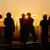 Visitors watch first sunrise of the year from rooftop of a commercial complex in central Tokyo, Japan