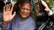 Muhammad Yunus waves from a car Muhammad Yunus waves from a car