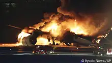 A Japan Airlines plane is on fire on the runway of Haneda airport on Tuesday, Jan. 2, 2024 in Tokyo, Japan. (Kyodo News via AP)