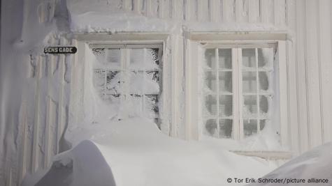 Thermometer on a frosty winter window. Outdoor temperature minus 12 degrees  celsius Stock Photo