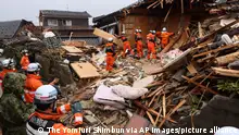 Firefighters search for victims at a collapsed house in Suzu City, Ishikawa Prefecture on January 6, 2024. A strong earthquake with magnitude of 7.6 hit the Noto peninsula of Ishikawa Prefecture, in central Japanese main island, on Jan. 1st.( The Yomiuri Shimbun via AP Images )