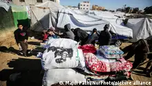 Displaced Palestinians are dismantling their tents inside Al-Aqsa Hospital following an Israeli bombing near the hospital in Deir Al-Balah in the central Gaza Strip, on January 7, 2024, amid ongoing battles between Israel and Hamas militants. (Photo by Majdi Fathi/NurPhoto)
