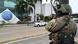An Ecuadorean soldier stands guard in front of Ecuador's TC television channel after unidentified gunmen burst into the state-owned television studio live on air An Ecuadorean soldier stands guard in front of Ecuador's TC television channel after unidentified gunmen burst into the state-owned television studio live on air