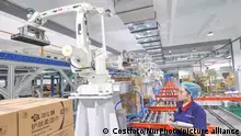 HUZHOU, CHINA - JULY 17, 2023 - Industrial robots work on a wipes packaging line at the smart factory of a cosmetics company in Huzhou city, Zhejiang province, China, July 17, 2023. In recent years, the enterprise has applied new information technologies such as the Internet of Things, artificial intelligence, intelligent warehousing, and 5G to build a new intelligent, digital, and automated smart factory. The high-end and differentiated wipes are exported to nearly 80 countries and regions such as the United States, Europe and Japan. (Photo by Costfoto/NurPhoto)