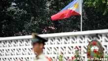The Philippines' flag flies at half mast at the embassy in Beijing on August 25, 2010 two days after eight Hong Kong tourists were killed in Manila when Philippine police stormed a bus during a hostage crisis. China on August 24 strongly condemned the bus hijacking in Manila that left eight Hong Kong tourists dead, while urging the Philippine government to ensure Chinese travellers were safe. CHINA OUT AFP PHOTO (Photo by AFP) (Photo by STR/AFP via Getty Images)