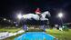 German show jumper Meredith Michaels-Beerbaum jumps over the water obstacle on her horse Fibonacci under floodlights German show jumper Meredith Michaels-Beerbaum jumps over the water obstacle on her horse Fibonacci under floodlights
