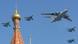 A Russian A-50 plane and Su-27 fighter jets fly over St. Basil's cathedral A Russian A-50 plane and Su-27 fighter jets fly over St. Basil's cathedral