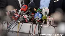 In this picture taken on June 28, 2018, microphones of the different Pakistani news channels are placed at a desk before a press conference outside the Supreme Court building, in Islamabad. - Facing abductions, censorship and financial ruin, journalists in Pakistan say they are under unprecedented pressure to bend to authorities' will as the country heads to nationwide polls, sparking allegations that the military is overseeing a silent coup. (Photo by AAMIR QURESHI / AFP) / TO GO WITH: Pakistan-media-elections-military, FOCUS by David STOUT (Photo credit should read AAMIR QURESHI/AFP via Getty Images)