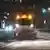 A vehicle clears the streets of snow in the Dresden city center 