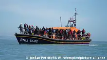 File photo dated 16/8/2023 of a group of people thought to be migrants are brought in to Dungeness, Kent, onboard an RNLI Dungeness Lifeboat, following a small boat incident in the Channel. More than 25,000 asylum seekers have arrived in Britain via small boats since Rishi Sunak became Prime Minister, according to figures analysed by the Labour Party. Issue date: Saturday August 19, 2023. See PA story POLITICS Migrants. Photo credit should read: Jordan Pettitt/PA Wire URN:73378673
