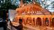 A man takes a selfie with a replica of the Ram Temple A man takes a selfie with a replica of the Ram Temple