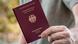 A man holds a German passport A man holds a German passport