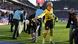 Julian Brandt throws chocolate coins off the pitch while playing for Borussia Dortmund Julian Brandt throws chocolate coins off the pitch while playing for Borussia Dortmund