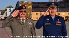 26/09/2023 A handout picture from the Libyan strongman Khalifa Haftar's self-proclaimed Libyan National Army's General Command's Facebook page, shows him (l) during a reception ceremony attended by Russia's Deputy Defence Minister Yunus-bek Yevkurov (R) at a Moscow military airfield on September 26, 2023. Haftar travelled to Russia for talks on the situation in the North African country, his self-styled army said. (Photo by GENERAL COMMAND OF THE LIBYAN NATIONAL ARMY (LNA) / AFP) / RESTRICTED TO EDITORIAL USE - MANDATORY CREDIT AFP PHOTO / LIBYAN NATIONAL ARMY'S GENERAL COMMAND'S FACEBOOK PAGE - NO MARKETING NO ADVERTISING CAMPAIGNS - DISTRIBUTED AS A SERVICE TO CLIENTS