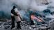 People are standing near the site of the missile strike, in Kharkiv, Ukraine, on January 23, 2024 People are standing near the site of the missile strike, in Kharkiv, Ukraine, on January 23, 2024