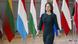 German foreign minister Annalena Baerbock walking in front of various national flags German foreign minister Annalena Baerbock walking in front of various national flags