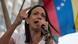 Maria Corina Machado speaking in front of the Venezuelan flag Maria Corina Machado speaking in front of the Venezuelan flag
