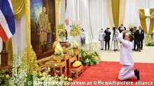 In this photo released by the Government Spokesman Office, the new Prime Minister Srettha Thavisin pays respect in front of the portrait of King Maha Vajiralongkorn as he receives the royal endorsement appointing him as the new prime minister in Bangkok, Thailand, Wednesday, Aug. 23, 2023. (Government Spokesman Office via AP)