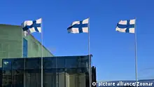 waving national flags of Finland on Finnish Independence Day