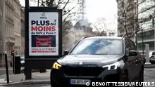 02/02/2024 A poster reading More or less SUVs in Paris? Vote on February 4 is seen on a billboard in a street as Paris City Hall is to organise a public vote on SUV cars in the city, in Paris, France, February 2, 2024. REUTERS/Benoit Tessier