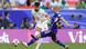 Iran's Ramin Rezaeian shoots as Japan's Daizen Maeda defends during the Asian Cup 2024 Iran's Ramin Rezaeian shoots as Japan's Daizen Maeda defends during the Asian Cup 2024