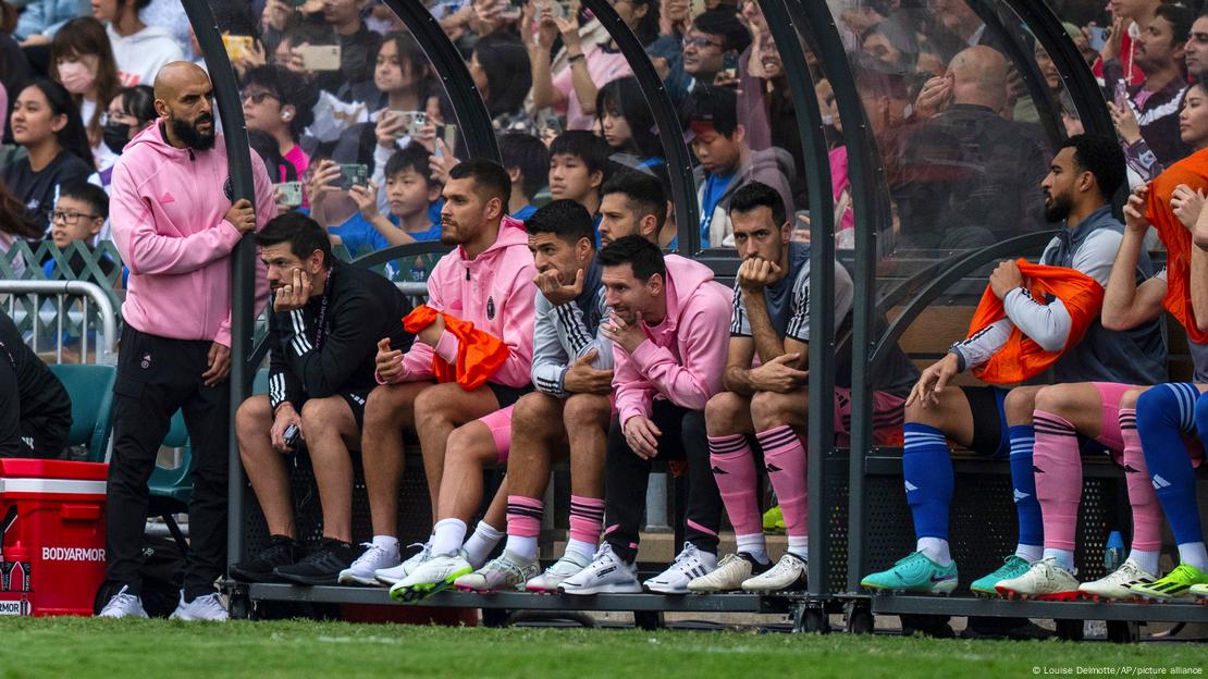 Inter Miami's Lionel Messi, sixth from left, looks on from the bench during the friendly football match between Hong Kong Team and US Inter Miami CF at the Hong Kong Stadium in Hong Kong, Sunday, Feb. 4, 2024. 